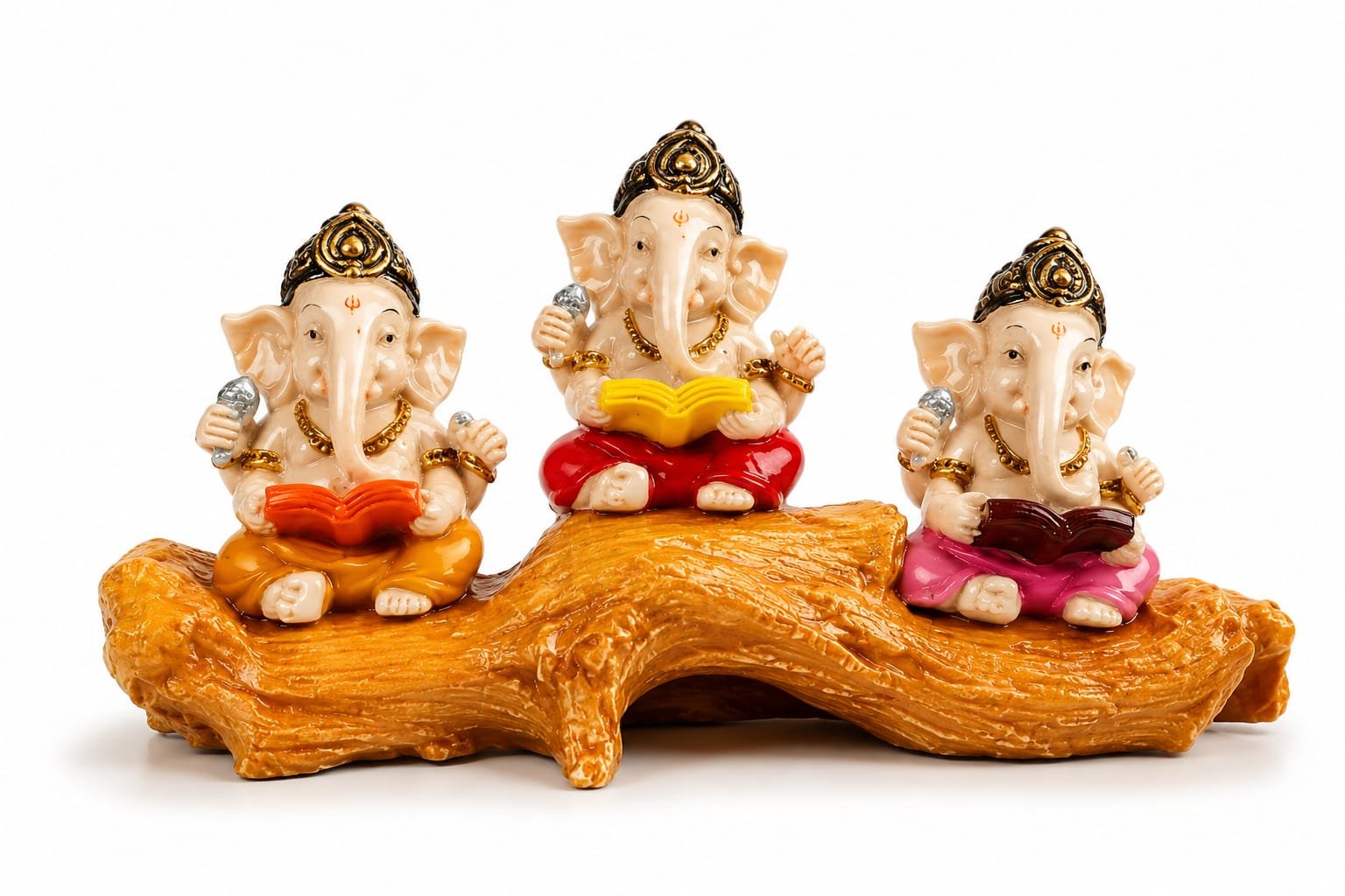 hree small, cream-colored Lord Ganesha idols