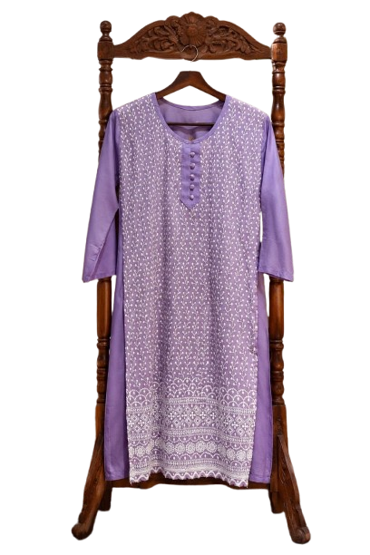 A straight-cut lavender purple cotton kurti hanging on a wooden garment stand. The front panel features all-over intricate white thread Chikankari embroidery consisting of vertical vine patterns. The round neckline is detailed with a matching fabric button placket. The bottom hem displays a heavy, multi-layered geometric and paisley embroidered border. The side panels and three-quarter sleeves are solid lavender without embroidery.